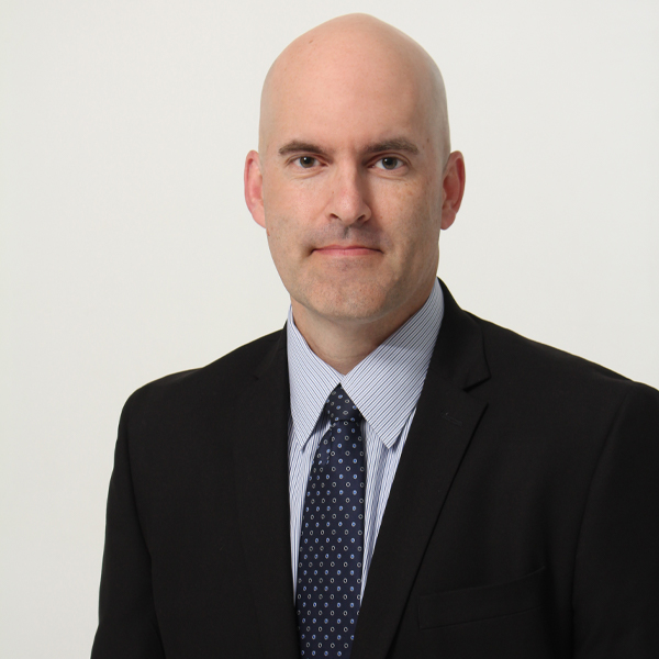 Dr. Kevin Bridge MD in a black suit from Bridge Plastic Surgery Skin and Vein in Abilene, TX